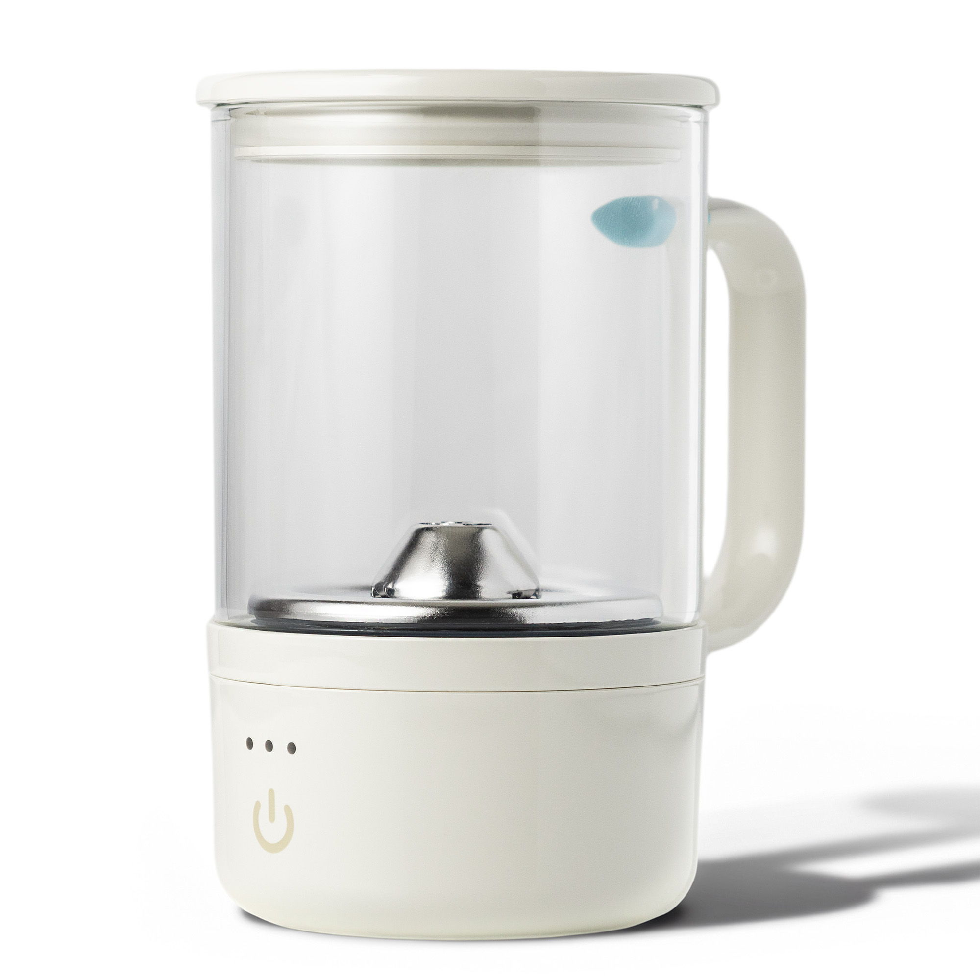 A modern glass electric kettle with a white base and handle.
