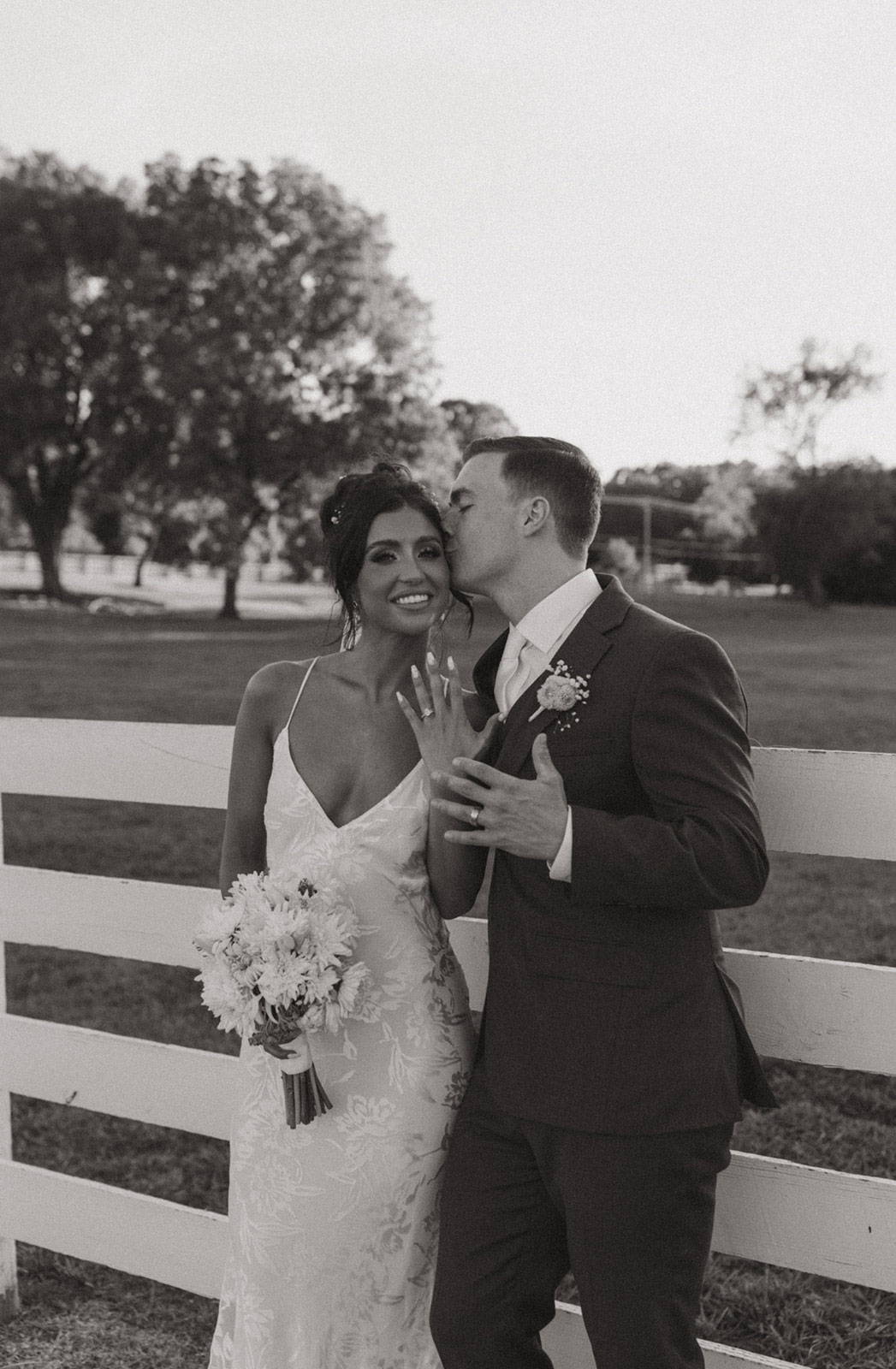 Bride and Groom showing off rings