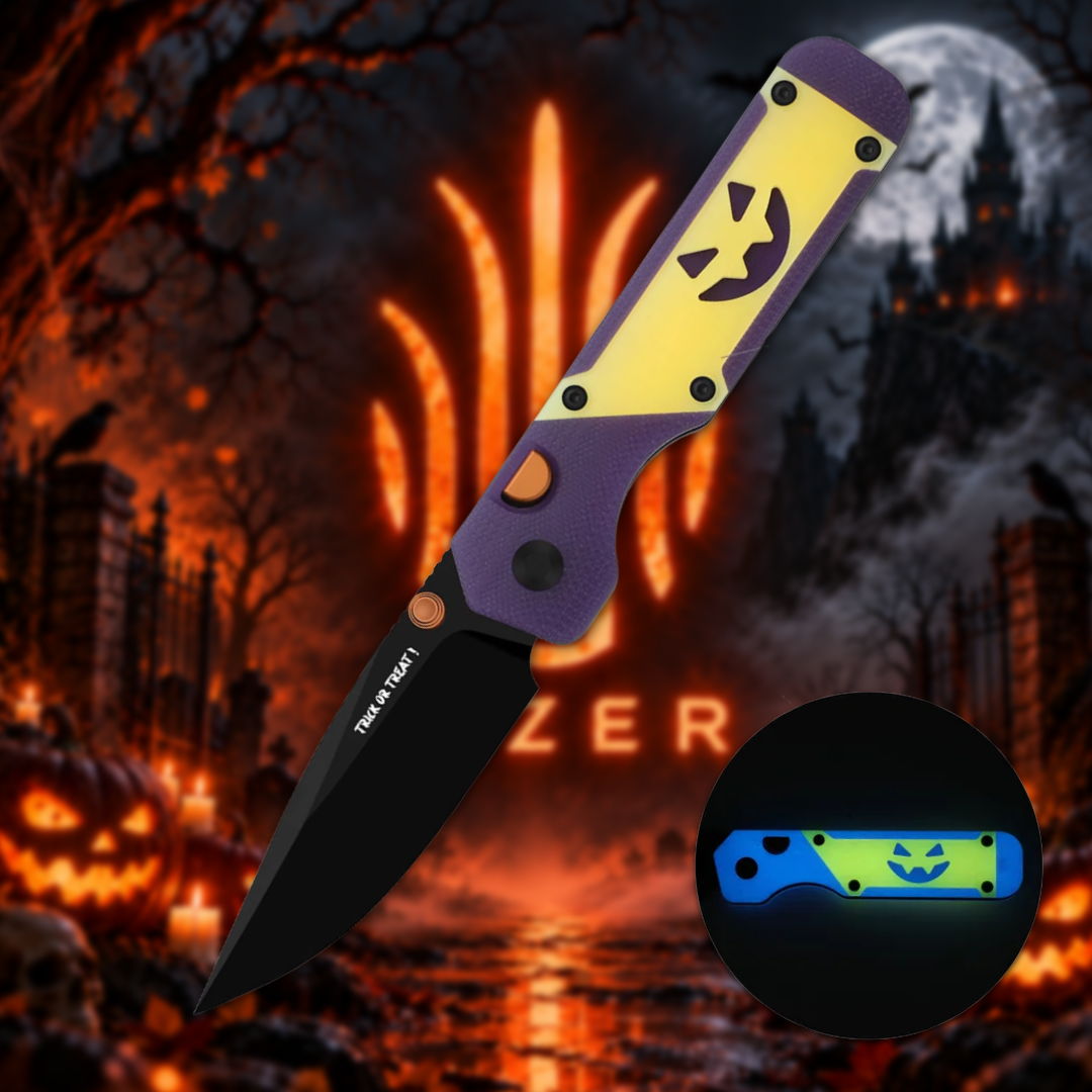 A Halloween-themed folding knife with a pumpkin design on the handle.