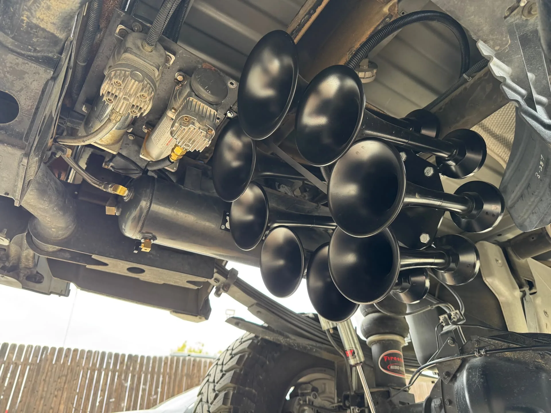 Fernando's 2016 GMC Sierra HD2500 train horn installation detail with Octohorn Train Horn photo 3