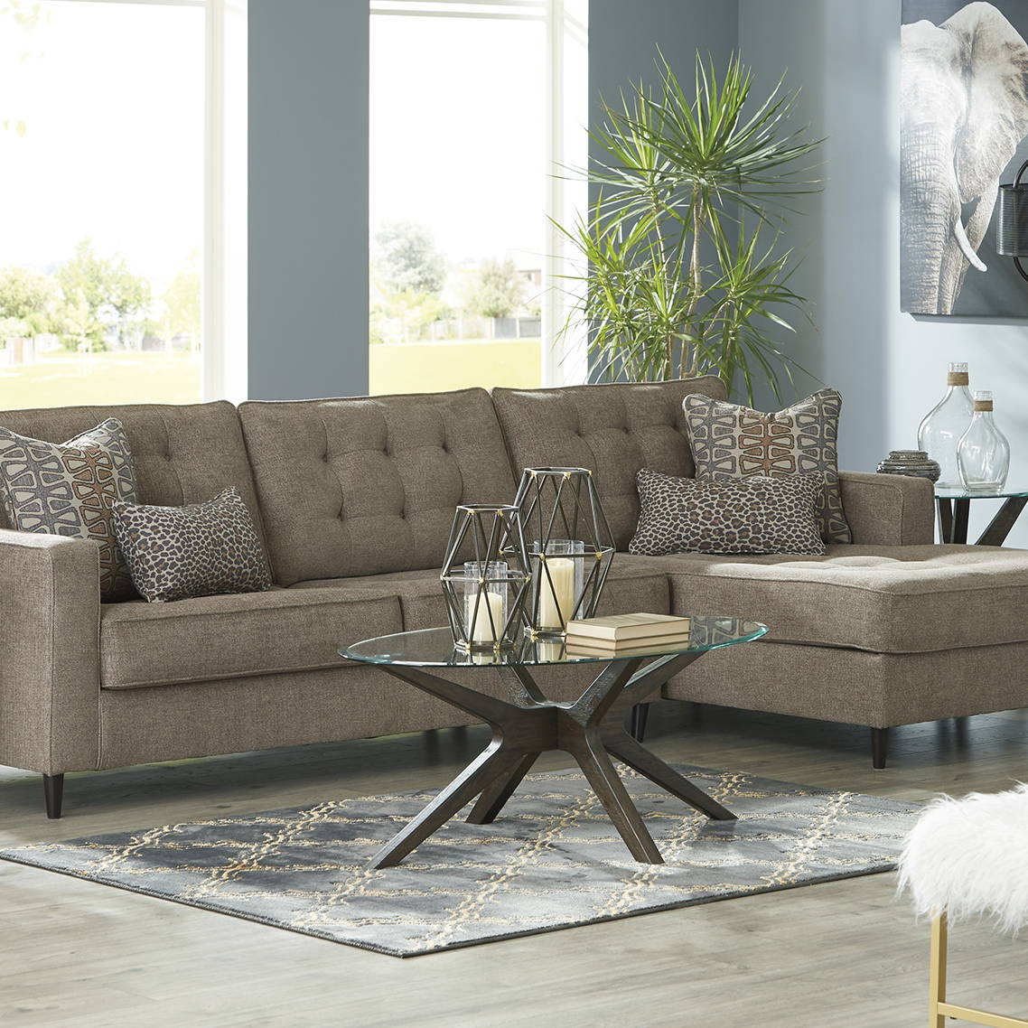 Ashley Brown Sectional, Cushions and a Coffee Table. Shop Sectionals Now
