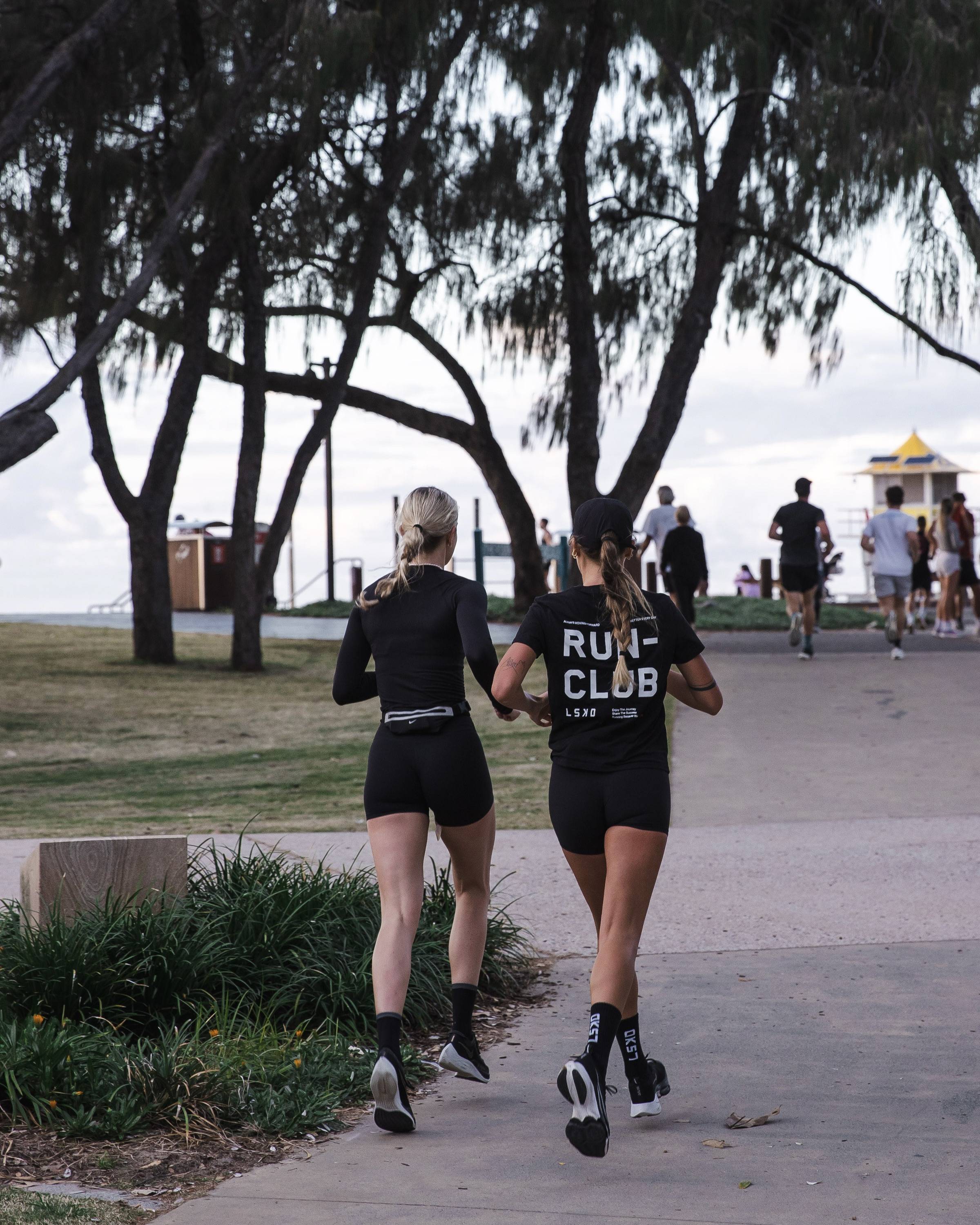 two girls running for global run day 2023