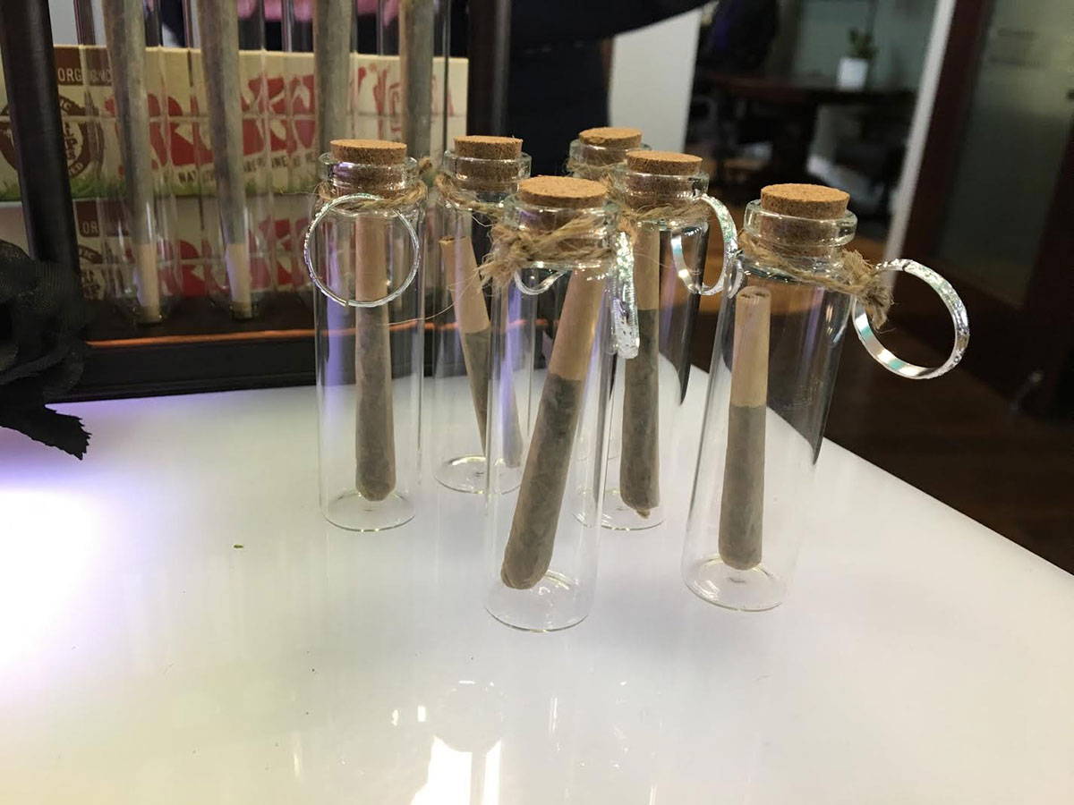 DopeBoo blunts in glass containers as party favors