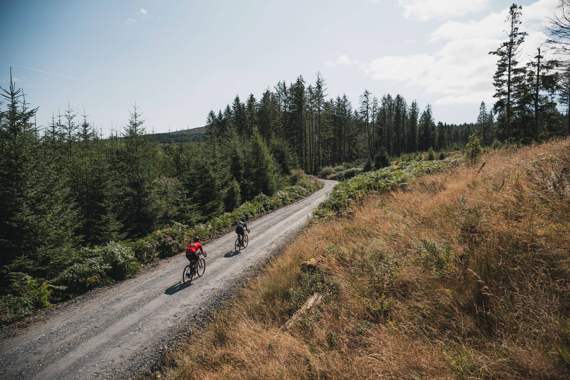 Two cyclists racing on a gravel track