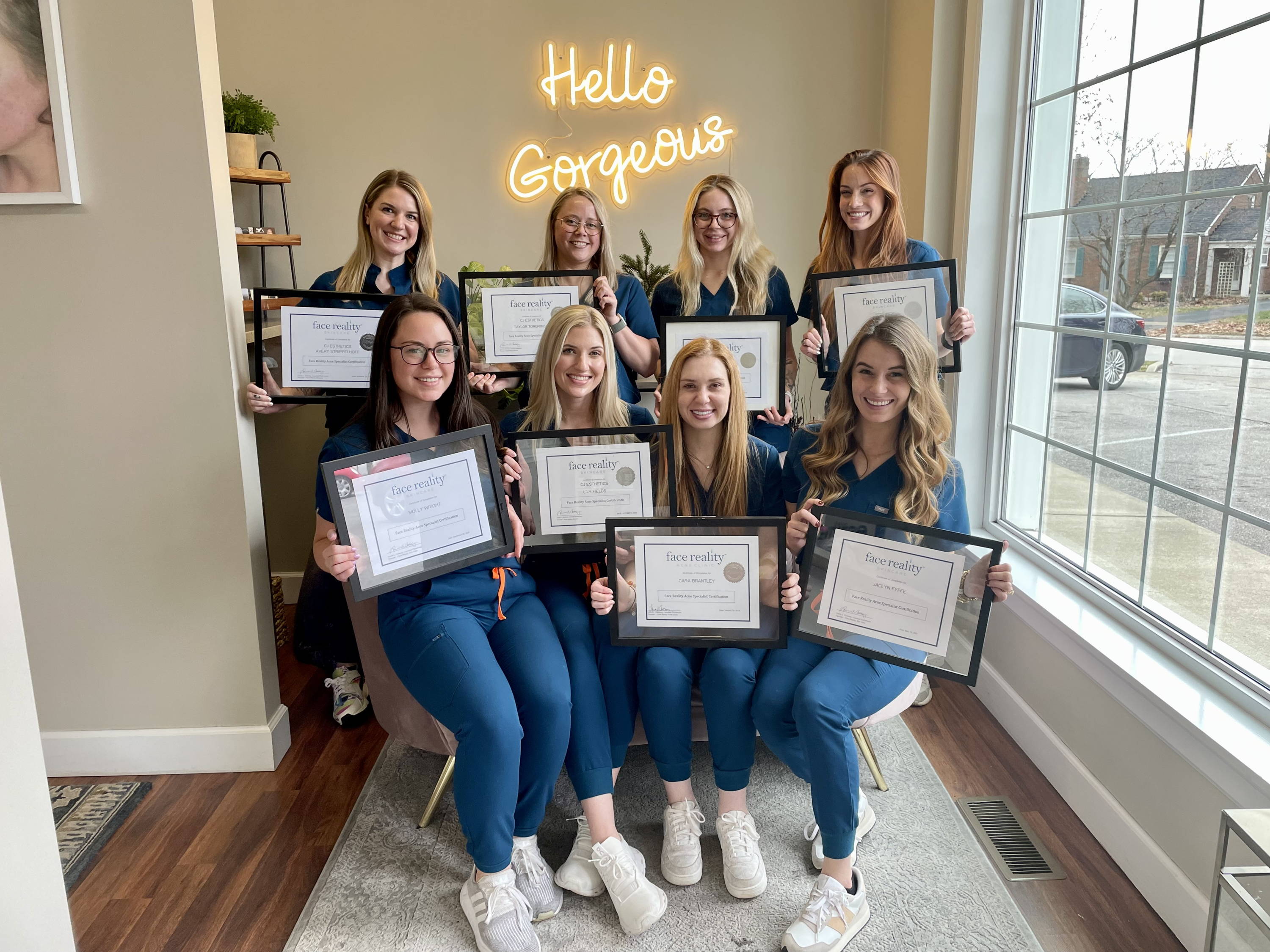 Face Reality Acne Expert CJ Williams with her employees, who have received Acne Specialist certificates from Face Reality