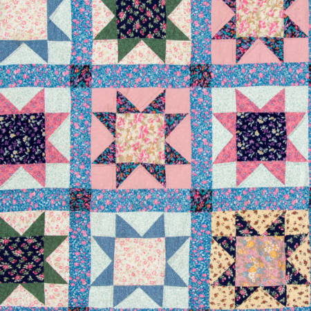 a quilt with sashing, strips between the blocks