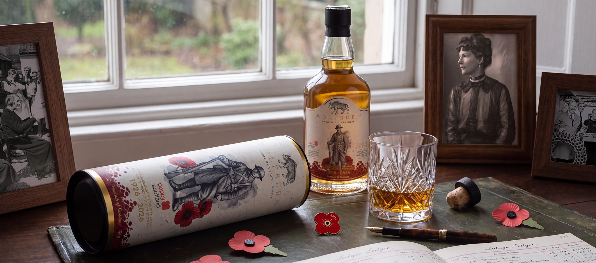 Vintage desk scene with poppies and limited edition whisky for remembrance day