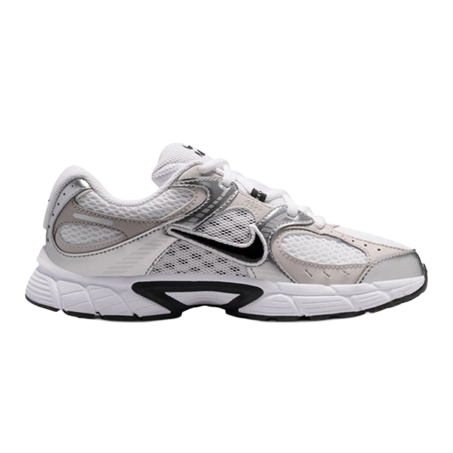 White and black Nike athletic shoes, side view.