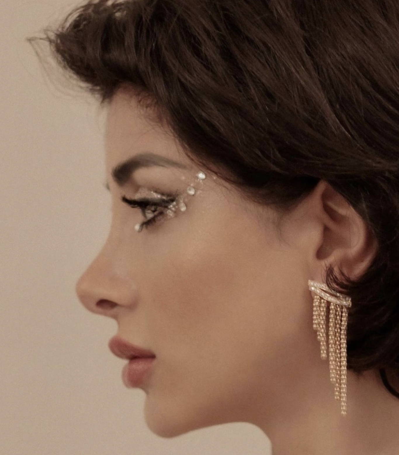 Eleonora Mar wears Soru Jewellery  Trevi Earrings 24ct gold plated silver fluid golden strands with Swarovski crystals
