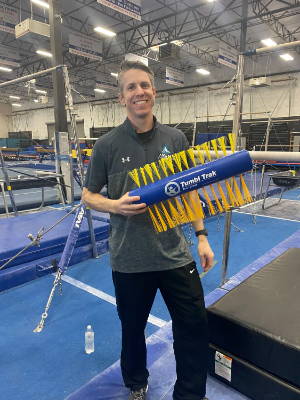 Coach Brett Wargo poses with the Tumbl Trak Porcupine Pad