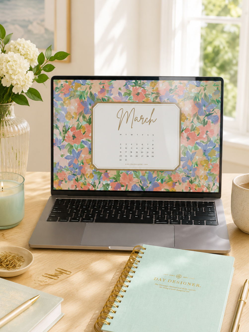 march 2026 Digital Wallpaper on Laptop, green planner, desk, pen, book, vase with flowers, window, framed picture