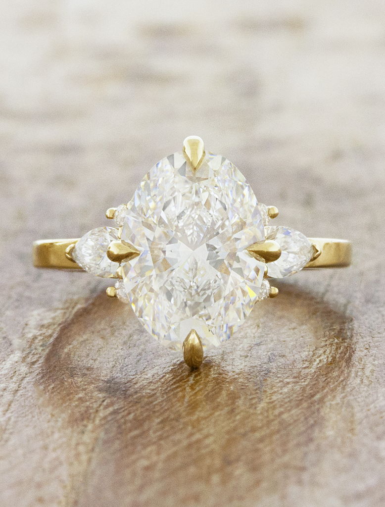 caption:Shown with 3ct oval diamond in 14k yellow gold