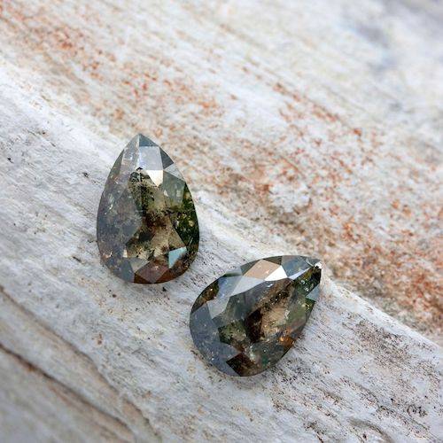 two loose pear shaped rough salt & pepper diamonds 