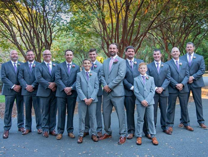 Wedding party group with the guys, groom, groomsmen and junior groomsmen