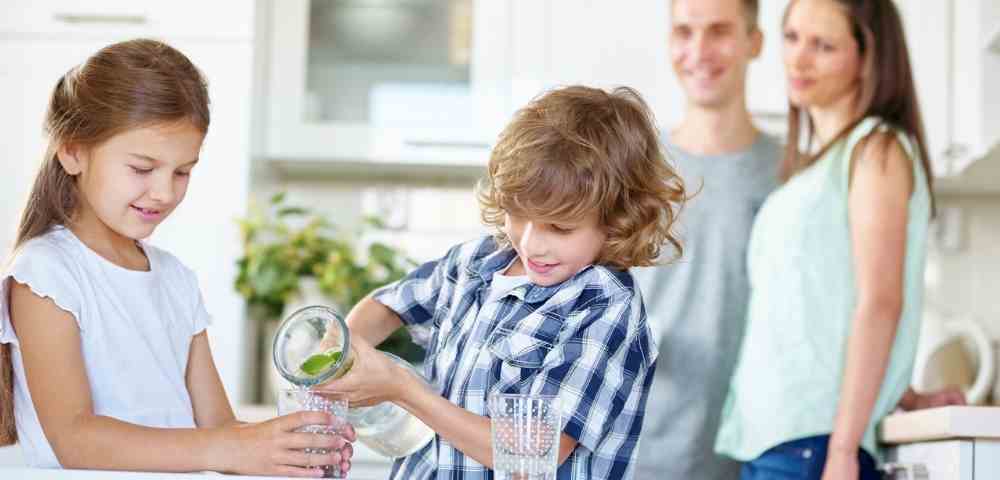 family drinking water filtered from a reverse osmosis system