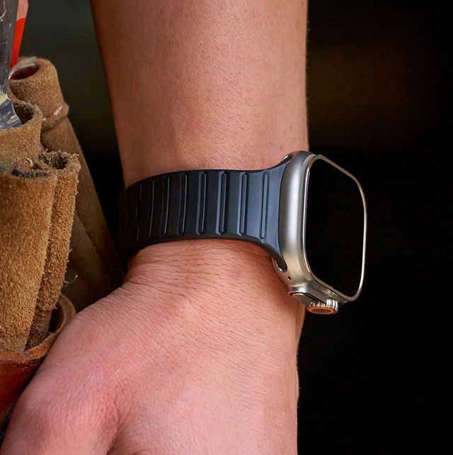 A close-up of a wrist wearing a smartwatch.
