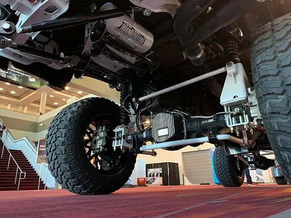 HornBlasters air tank and train horns mounted on the undercarriage of Eric's lifted 2018 Ford F250 at an automotive show