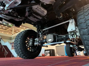 HornBlasters air tank and train horns mounted on the undercarriage of Eric's lifted 2018 Ford F250 at an automotive show