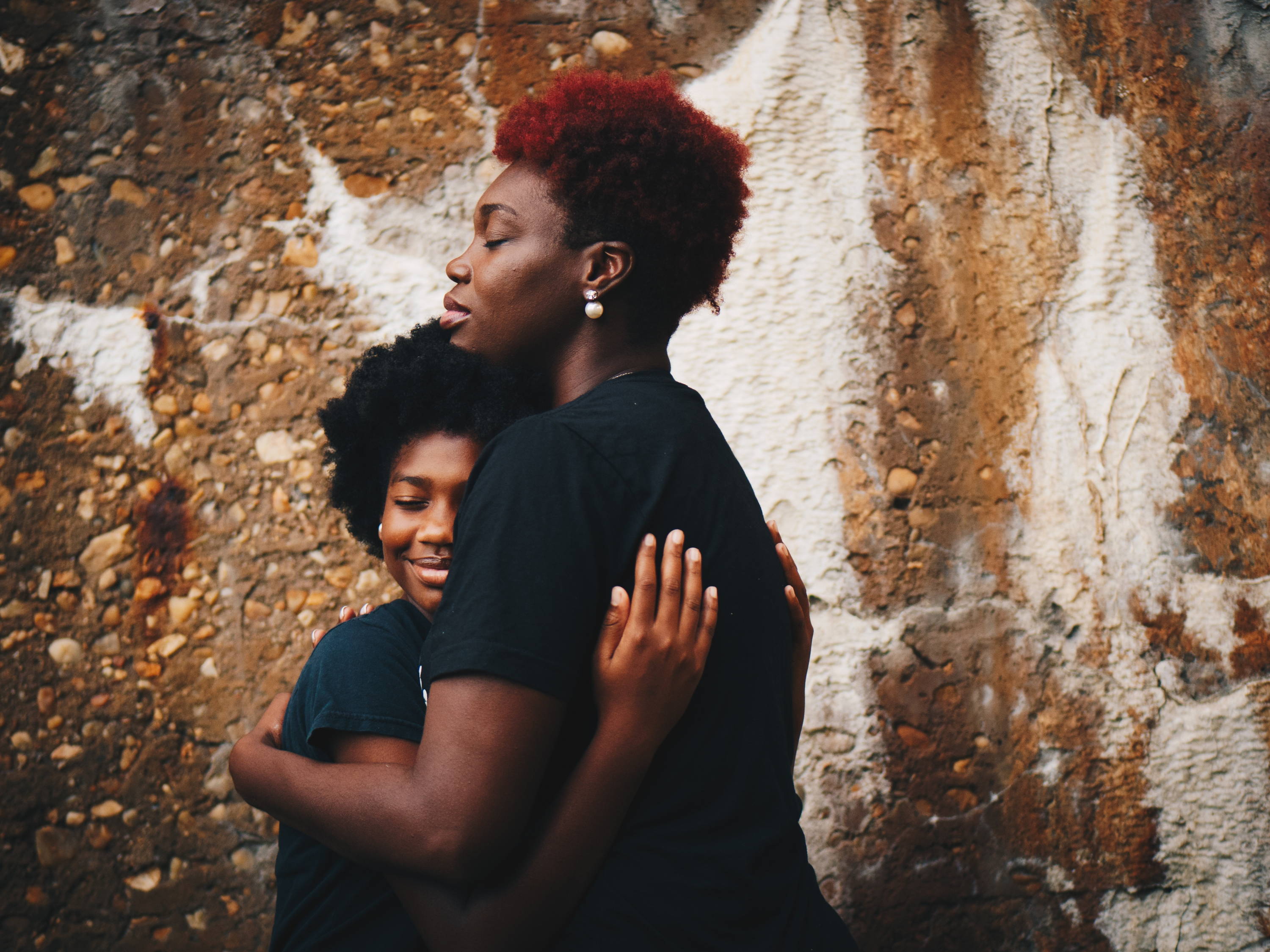 Mother and daughter hugging 