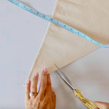 Using a heat-erasable pen and measuring tape to mark a 4-inch semicircle stem hole
