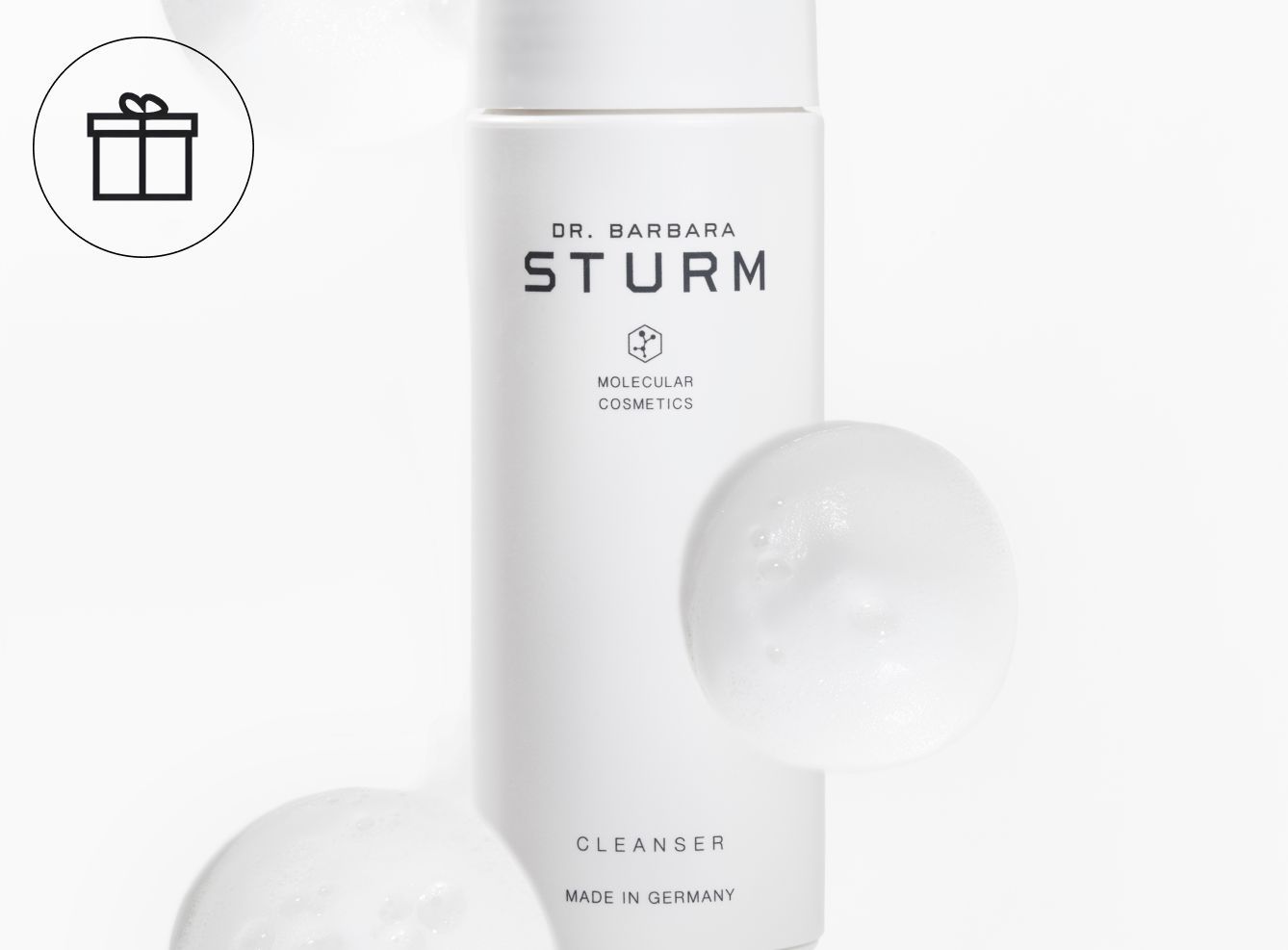White bottle of Dr. Barbara Sturm cleanser with bubbles.