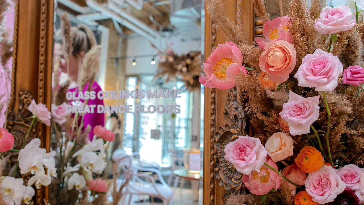 Pink and Peach Floral Installation Around a Mirror