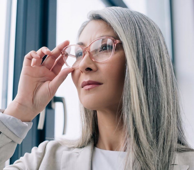 Woman with grey hair wearing Glee Pink light acetate frames