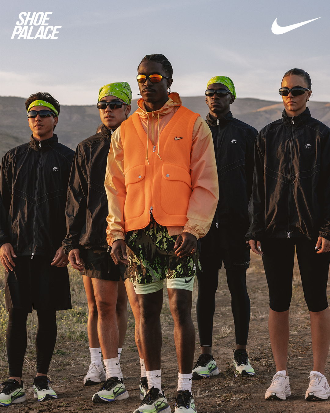 A group of six people in sporty outfits outdoors.