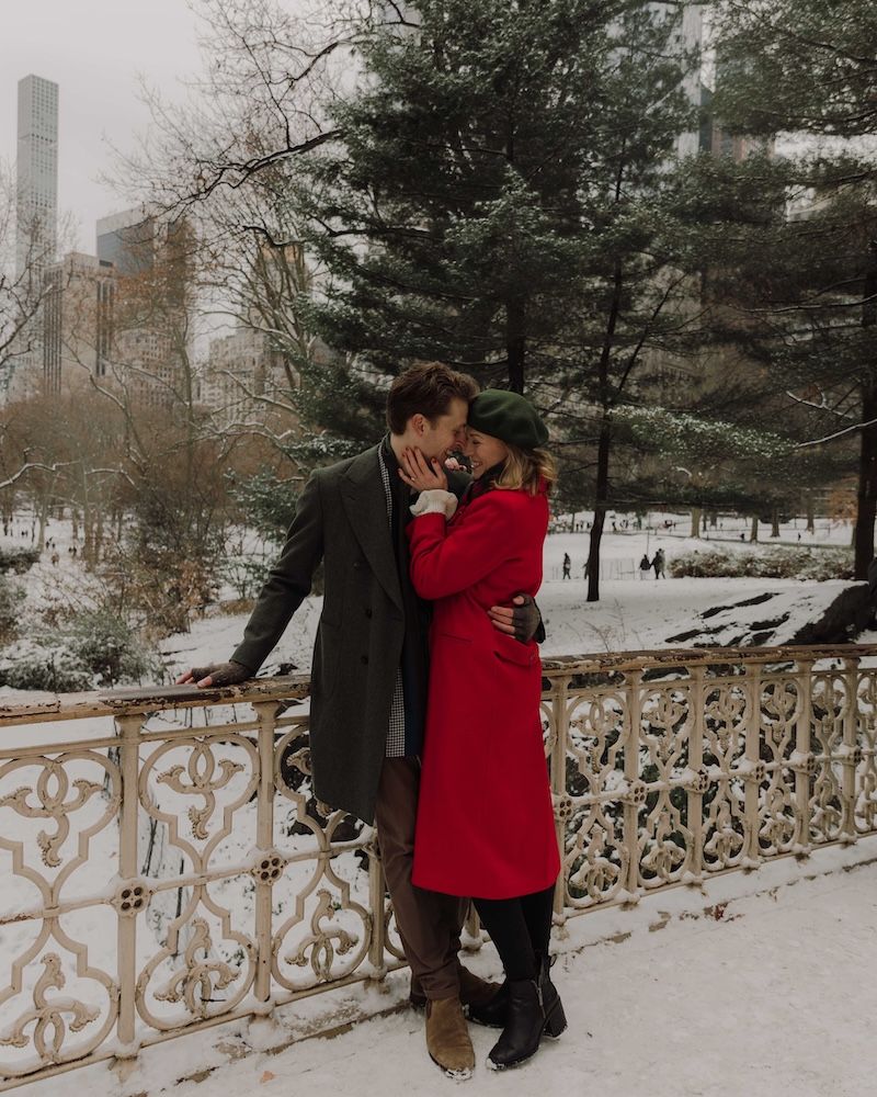 newly engaged couple embracing in wintertime, central park