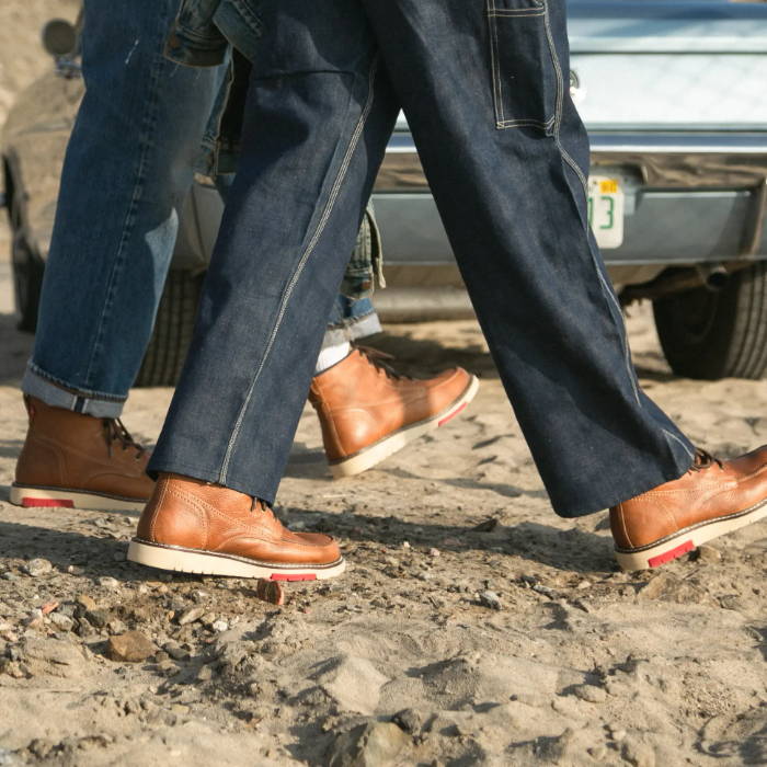 man and woman in stride wearing levi's boots