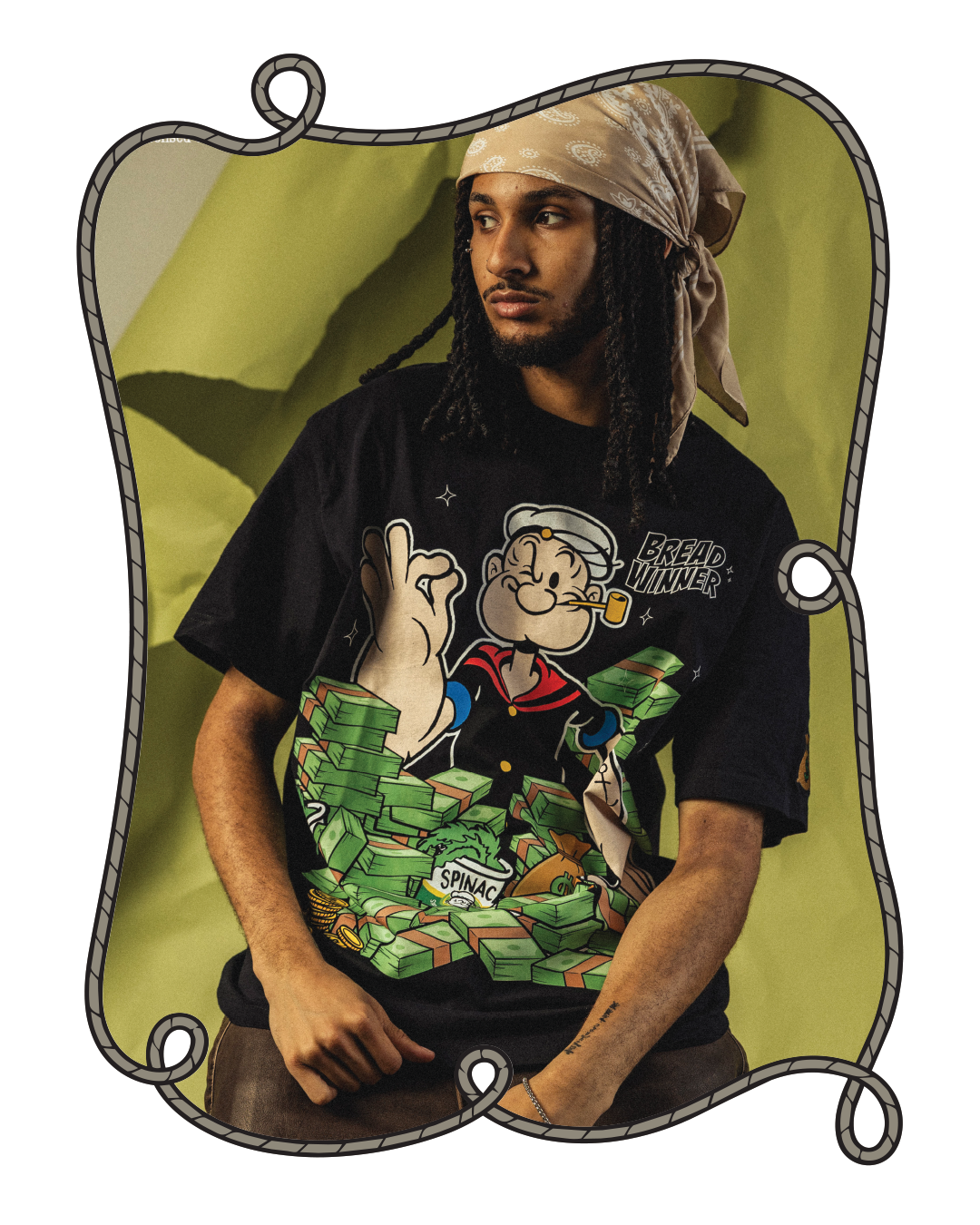 Person wearing a black t-shirt with a cartoon character on it.