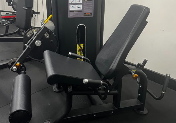 Leg press machine in a gym setting.