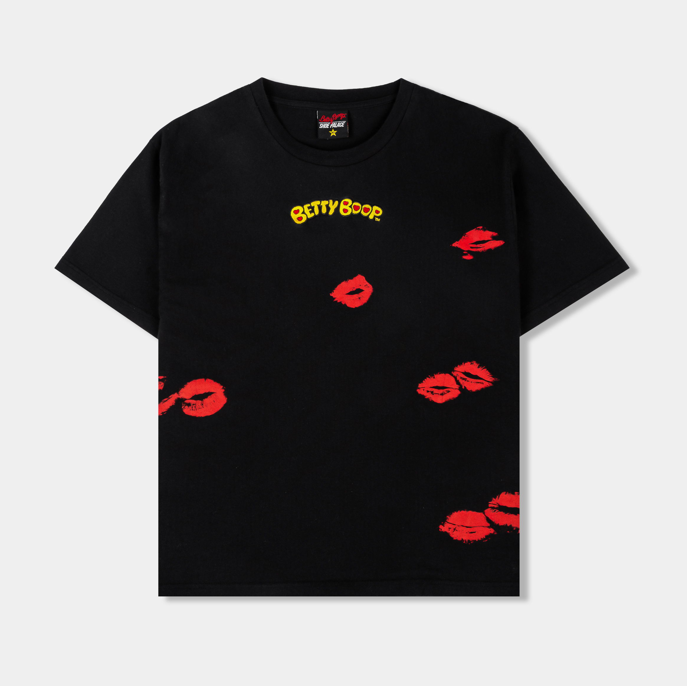 Black t-shirt with red lips graphic design and yellow text.