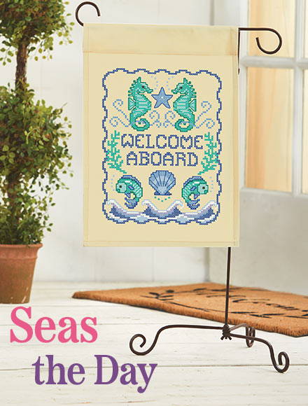Seas the Day. Image: Welcome aboard needlework banner.
