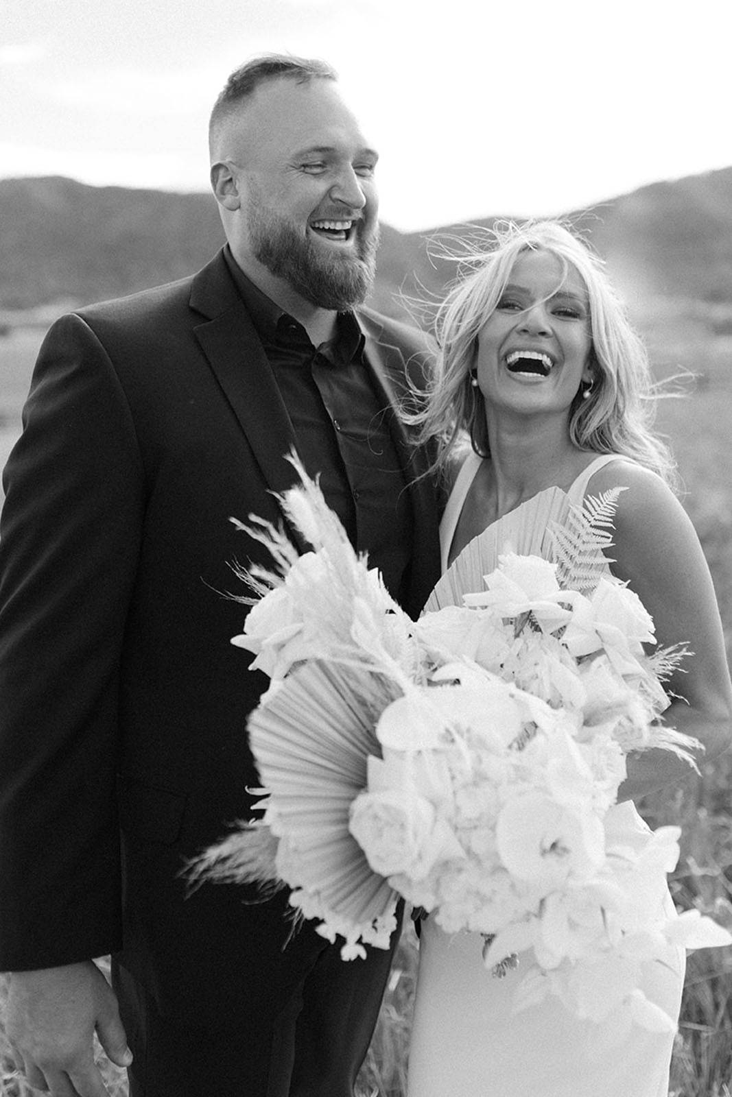 bride and groom laughing