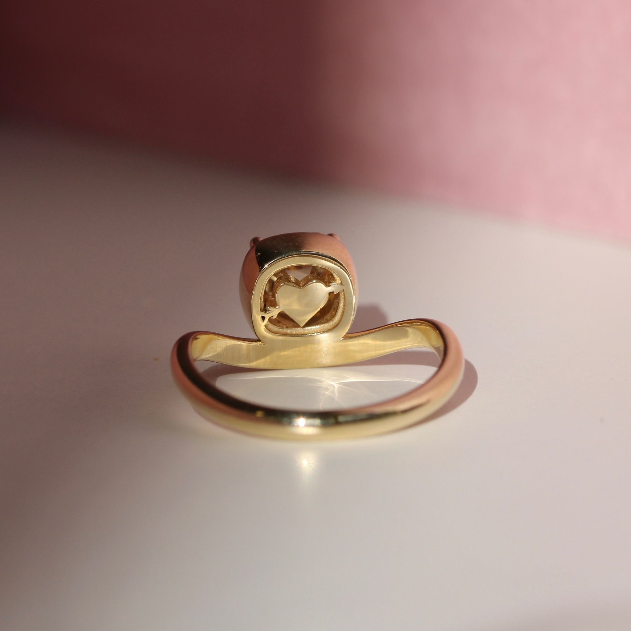 Champagne diamond ring in yellow gold with hand-carved heart cutout under basket by Cat Cason Fine