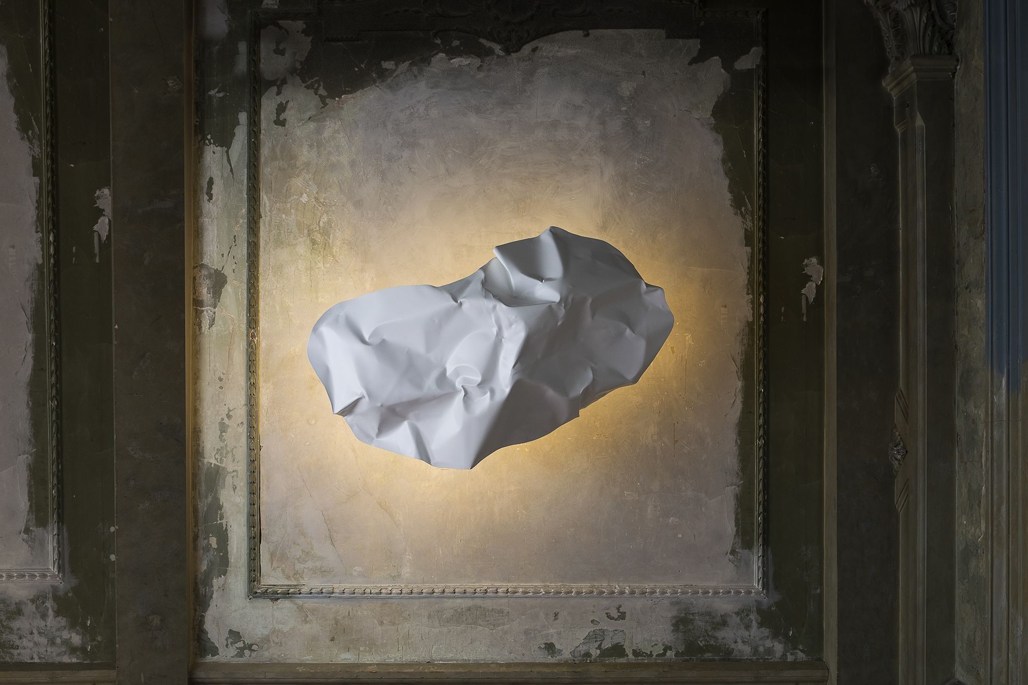Crash albus wall light in a framed wall opening with soft light.
