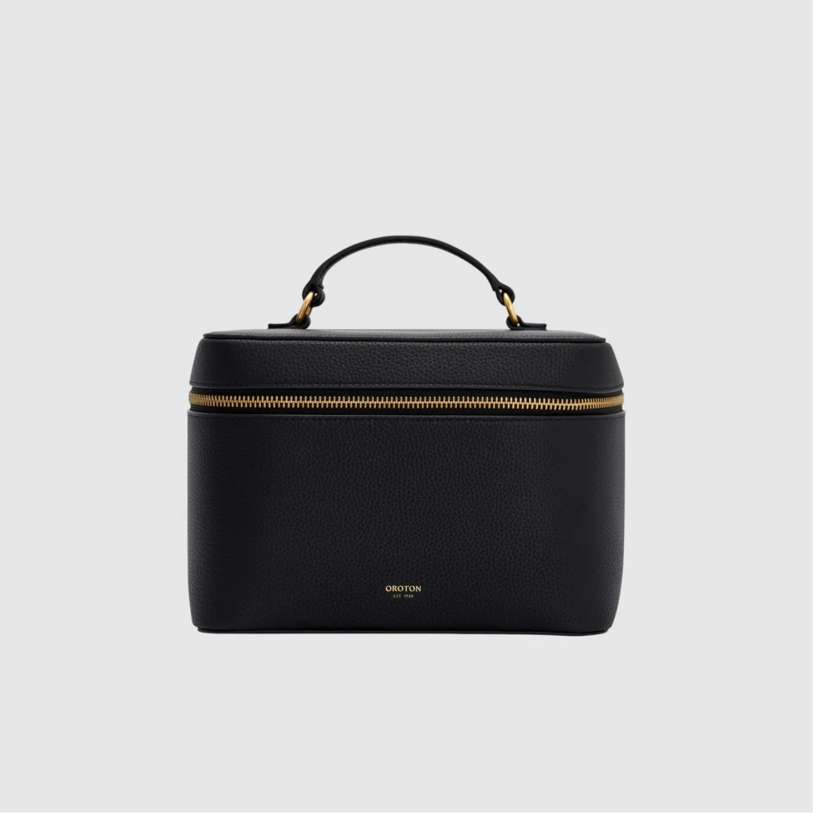 Black leather bag with a gold zipper and handle.