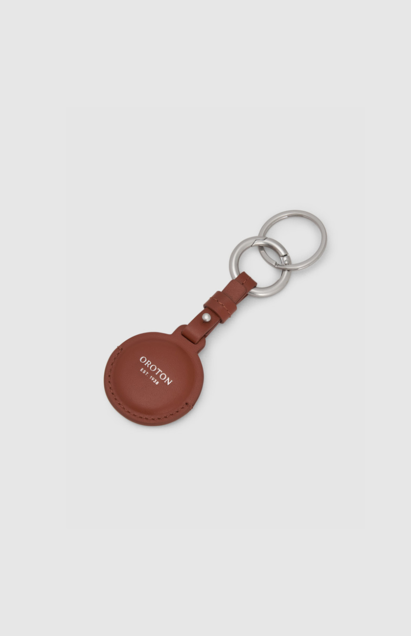 Brown leather keychain with silver rings.
