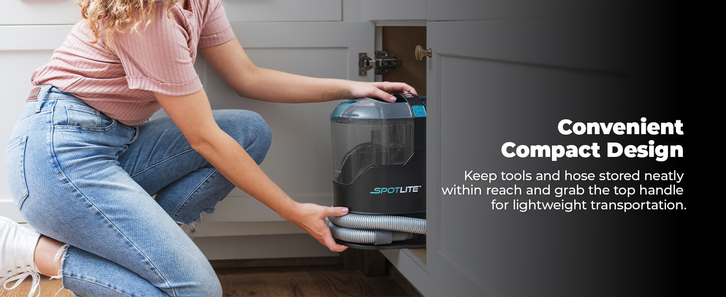 Person using a compact appliance with a handle in a modern kitchen.