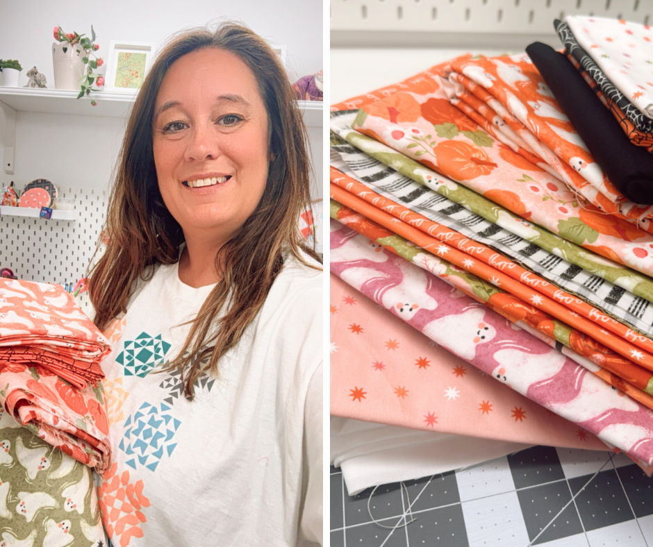 Woman smiling with fabric stacks on one side and colorful fabric pieces on the other.