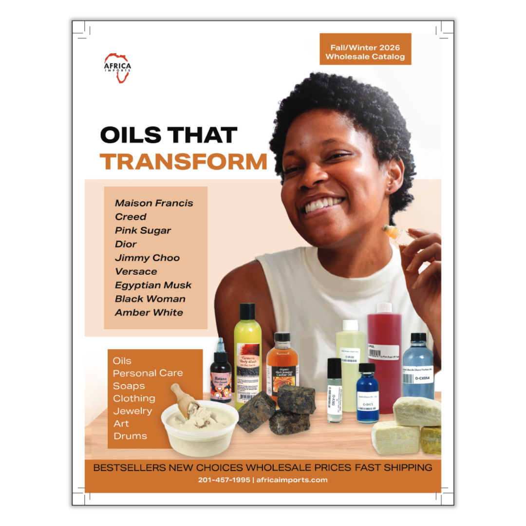 A woman smiling with various oil products displayed around her.