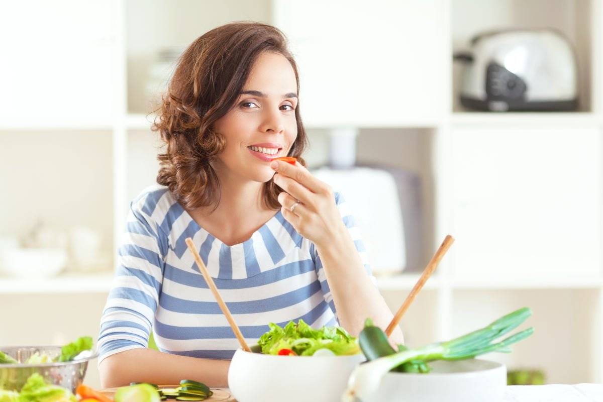 Woman eating vegetables | Heal The Mind-Body Connection | stress management