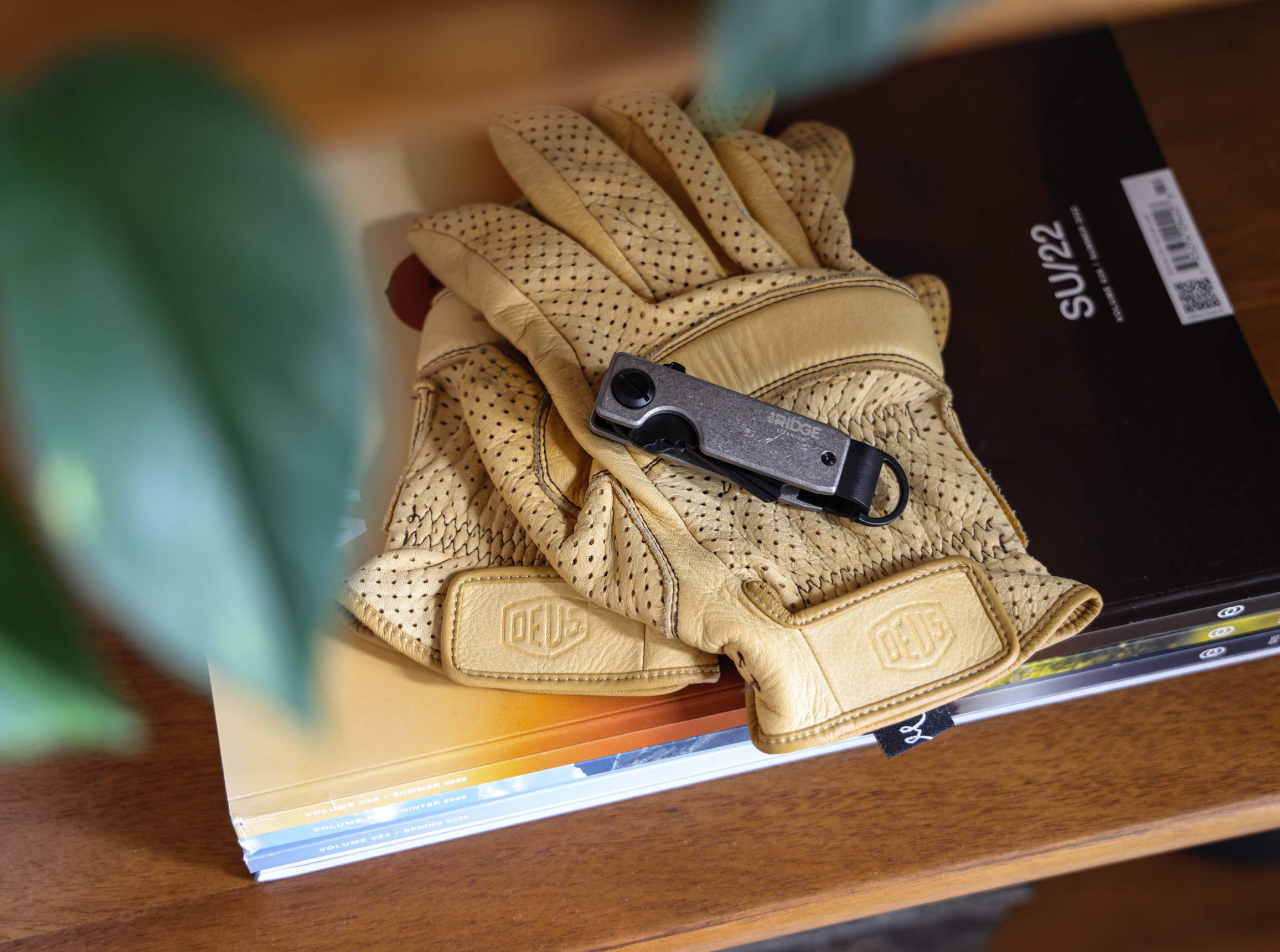 Ridge Stonewashed Titanium keycase on top of gloves