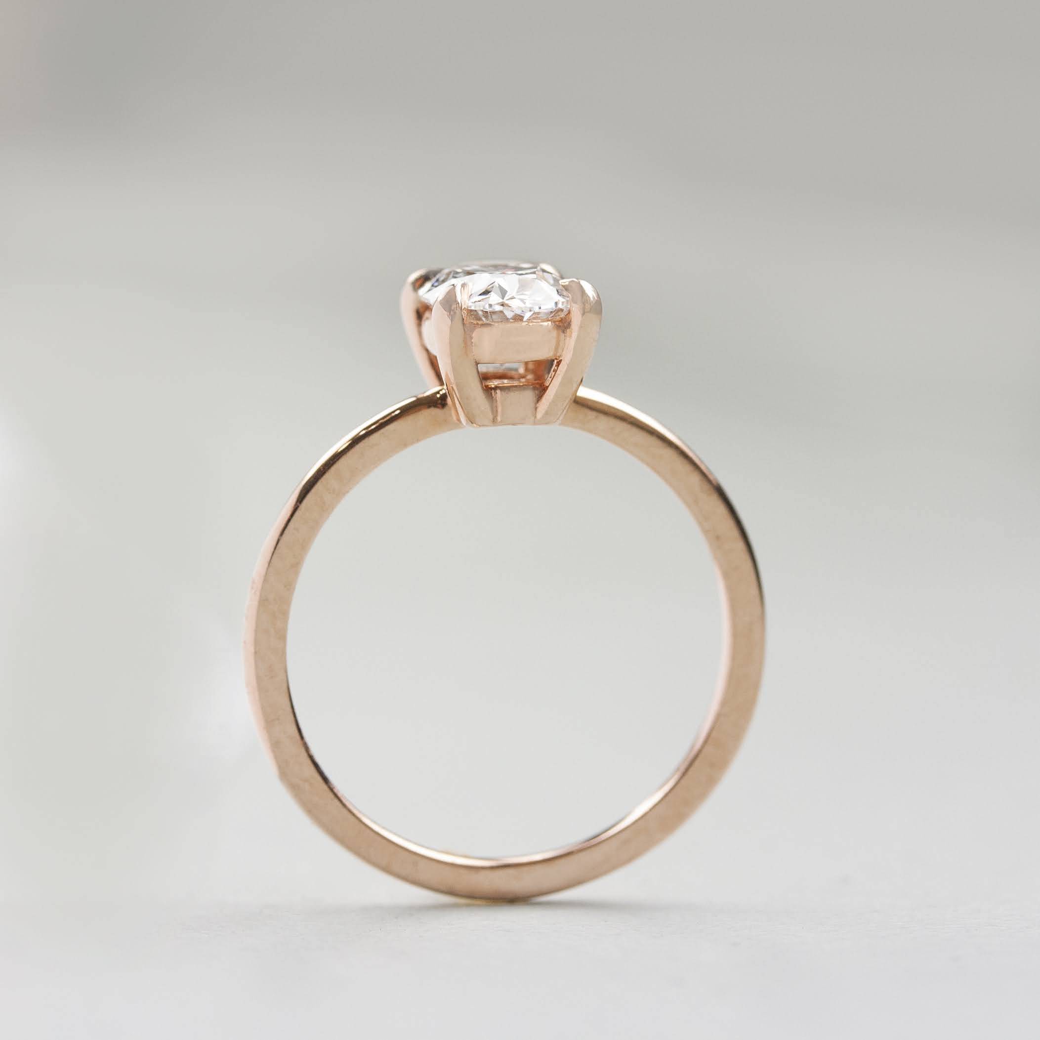 basket setting engagement ring in rose gold