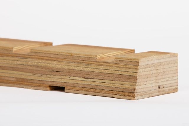 A wooden block with grooves on a white background.