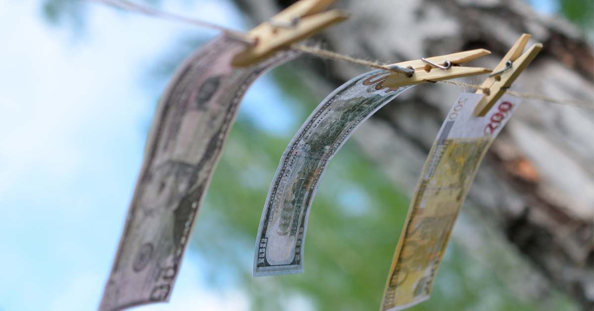 Money hanging from clothes line