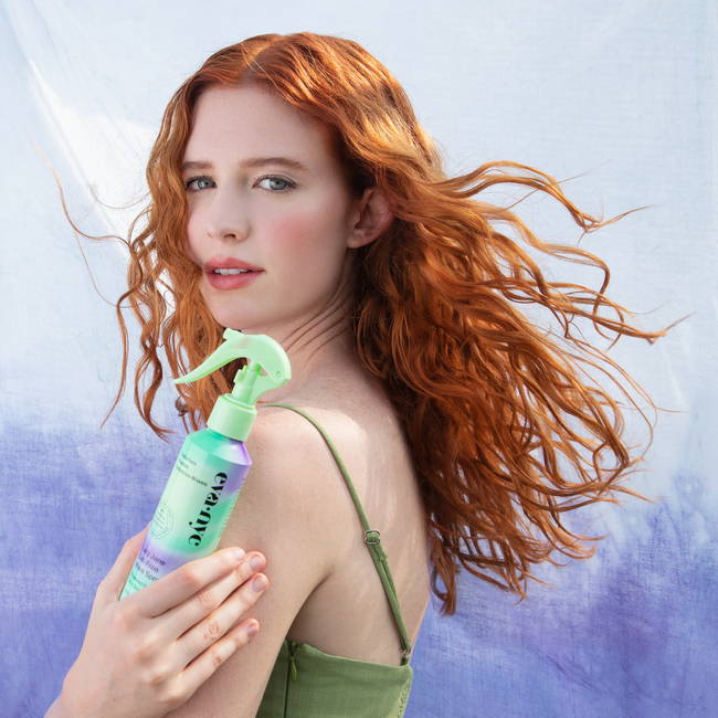 Model holding Lazy Jane Salt Free Wave Spray 