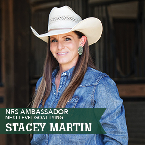 A woman in a cowboy hat promoting goat tying.