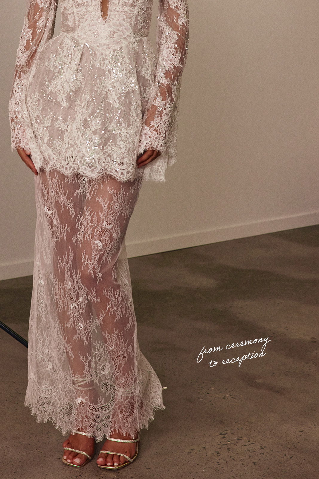Model wearing a short lace bridal dress with intricate detailing.